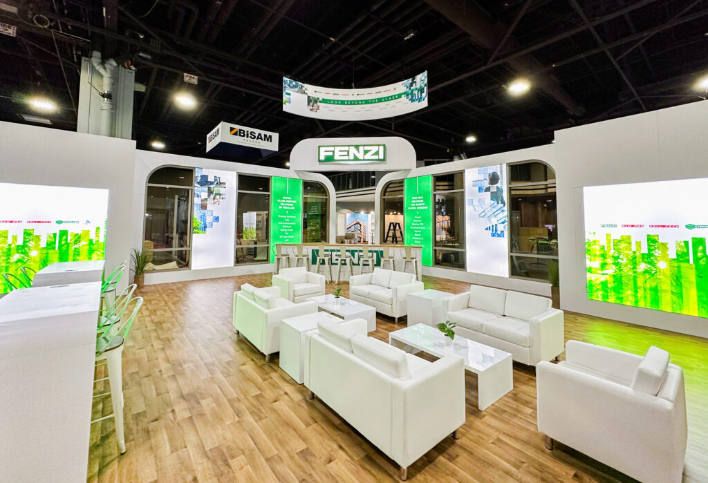 Spacious Fenzi exhibit booth with seating and illuminated product displays