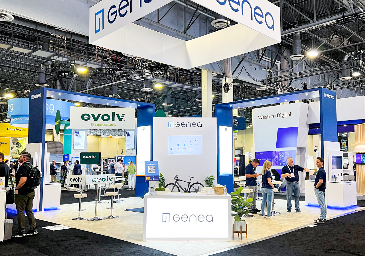 Glene and Ovolv trade show booth with suspended branded signage