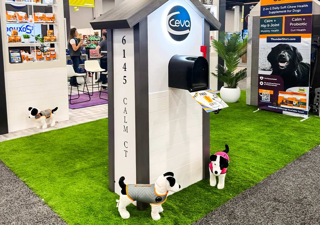 Custom exhibition booth with pet displays and green artificial grass