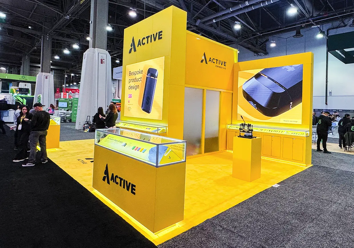 Angled view of yellow Active booth with illuminated product displays
