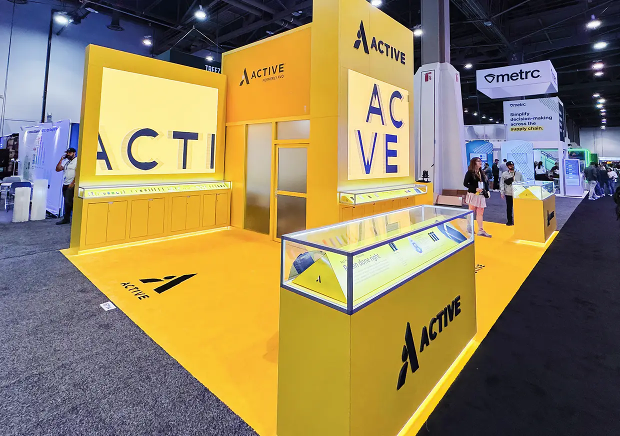 Side view of Active exhibition booth with branded illuminated panels