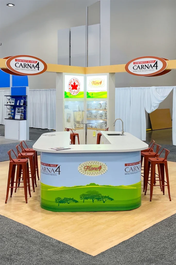 CARNA4 trade show booth featuring colorful pet food branding and counter