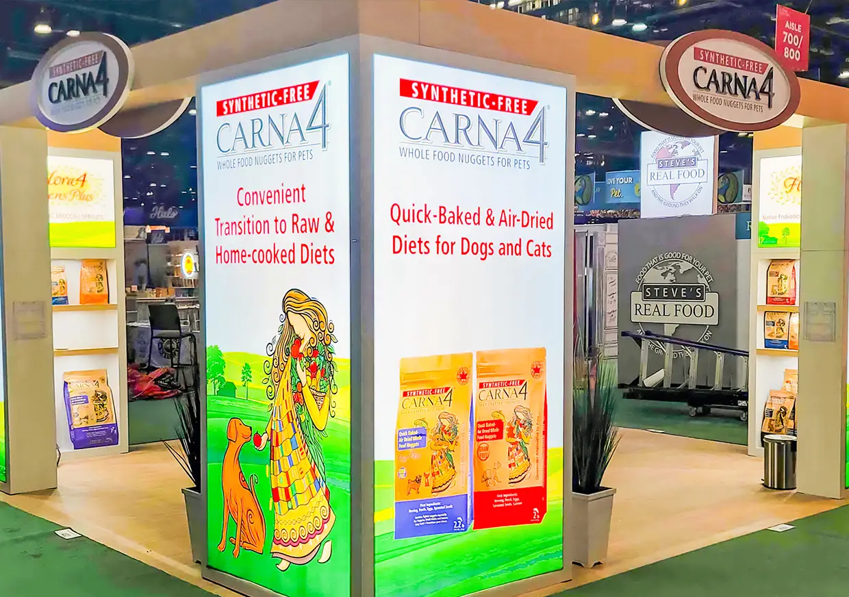 CARNA4 booth panels promoting air-dried pet food and real ingredients