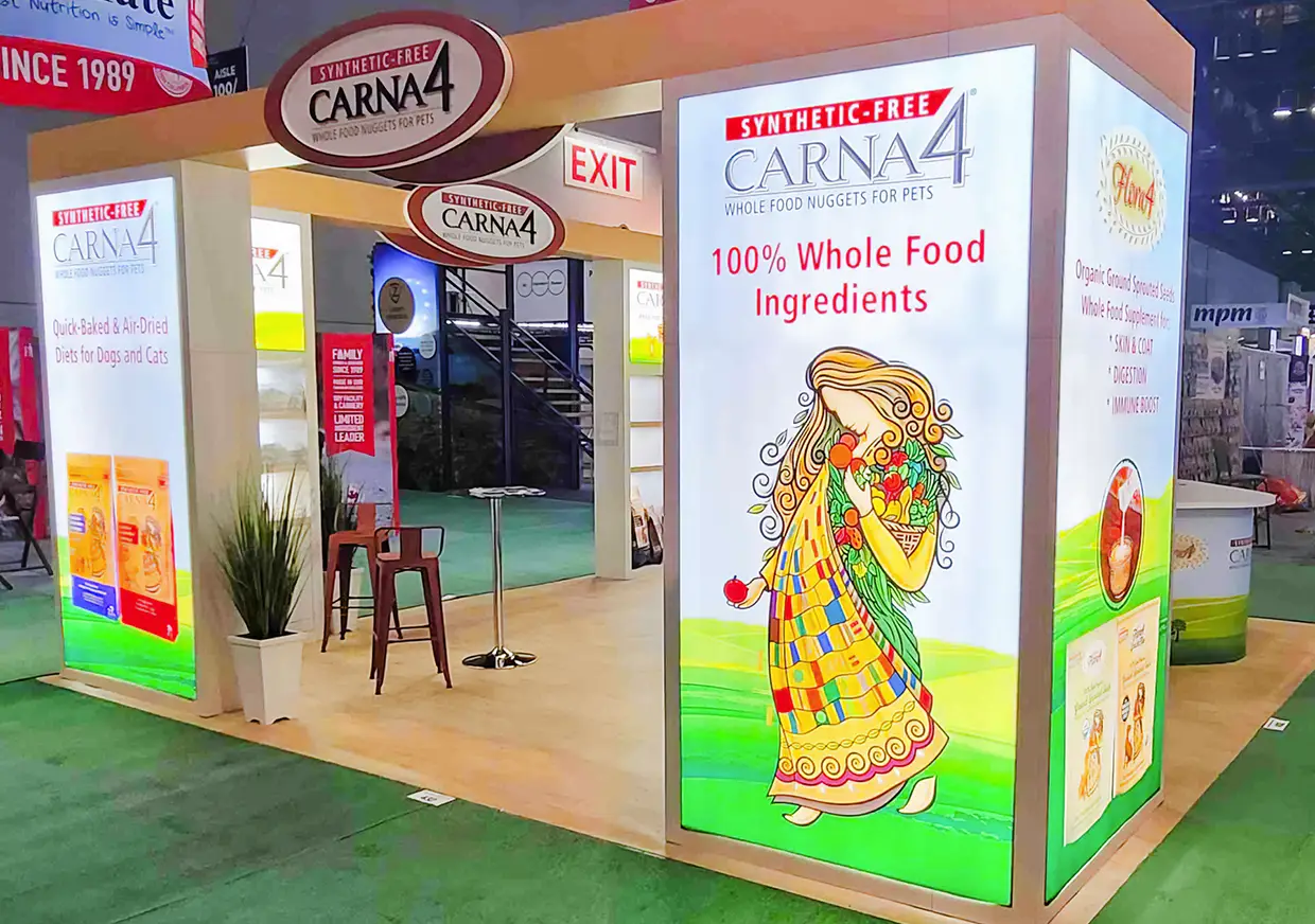 Corner view of CARNA4 exhibition booth with colorful branded graphics